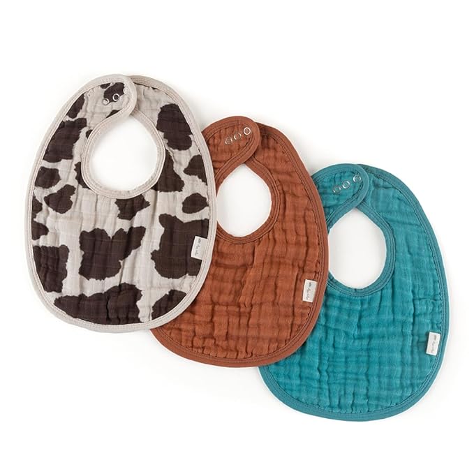 Itzy Ritzy Set of 3 Baby Bibs - Ultra-Soft Adjustable Infant & Toddler Bibs Made of Triple-Layer Cotton Muslin, Ideal for Drooling, Teething, & Eating - 3 Stylish, Coordinating Prints (Cow Print)