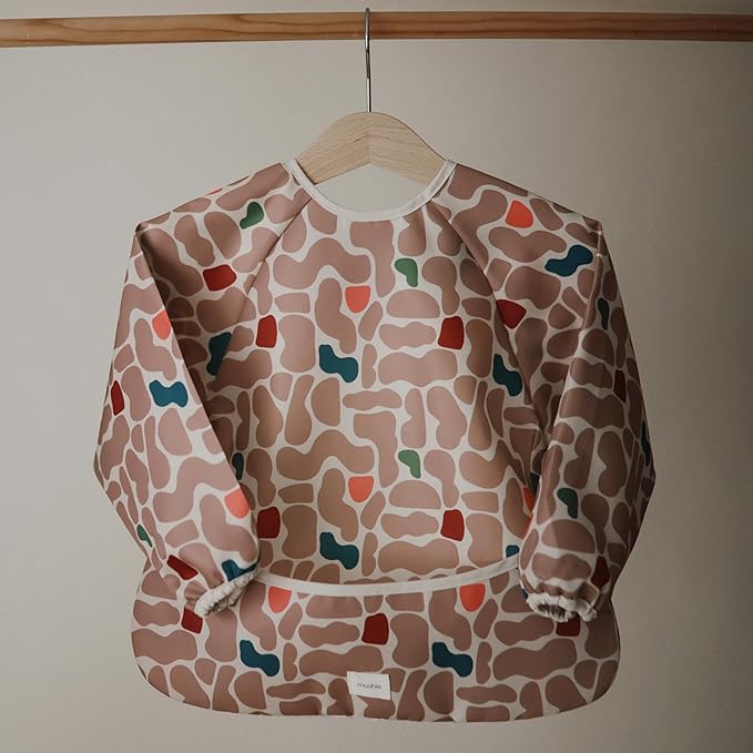 mushie Long Sleeve Baby Bib | Water Resistant Adjustable Fit for Ages 6-24 Months